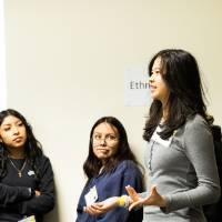 Girls of Color Summit previous event with a group having a discussion